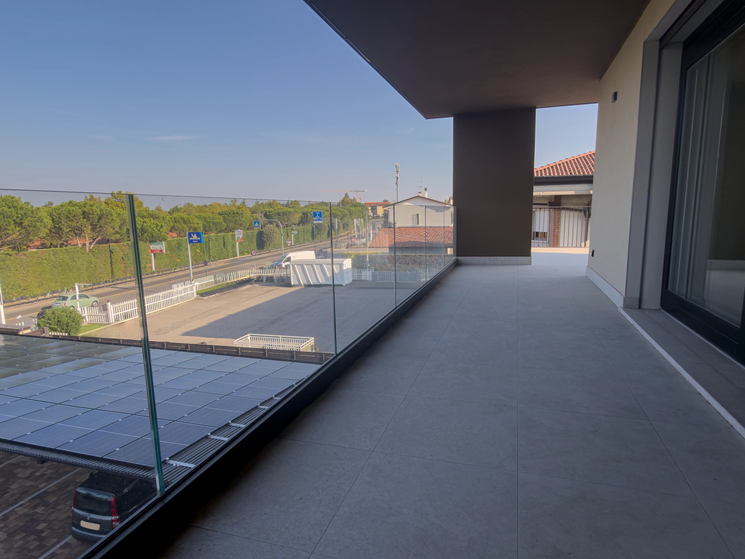Covered balcony with glass railing