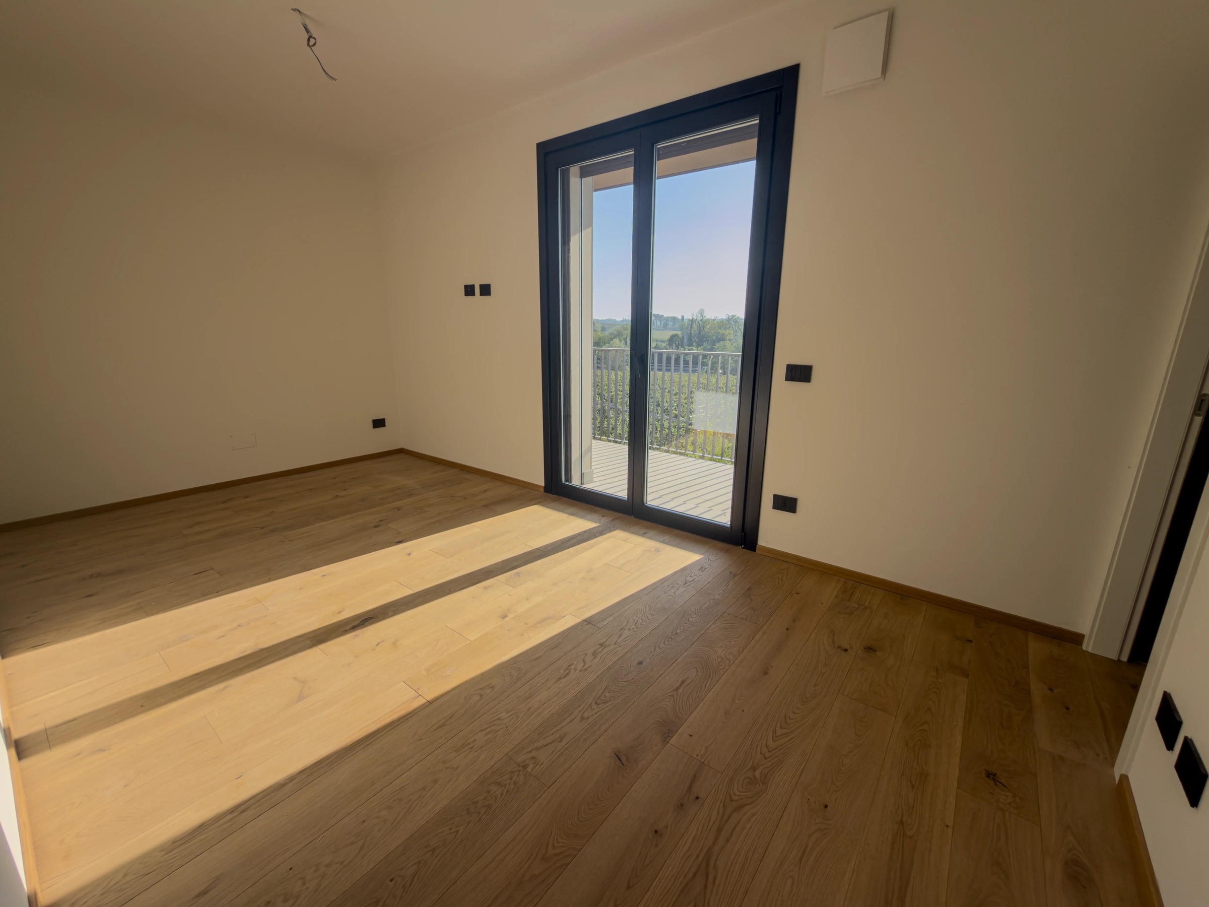Master bedroom opening onto the balcony