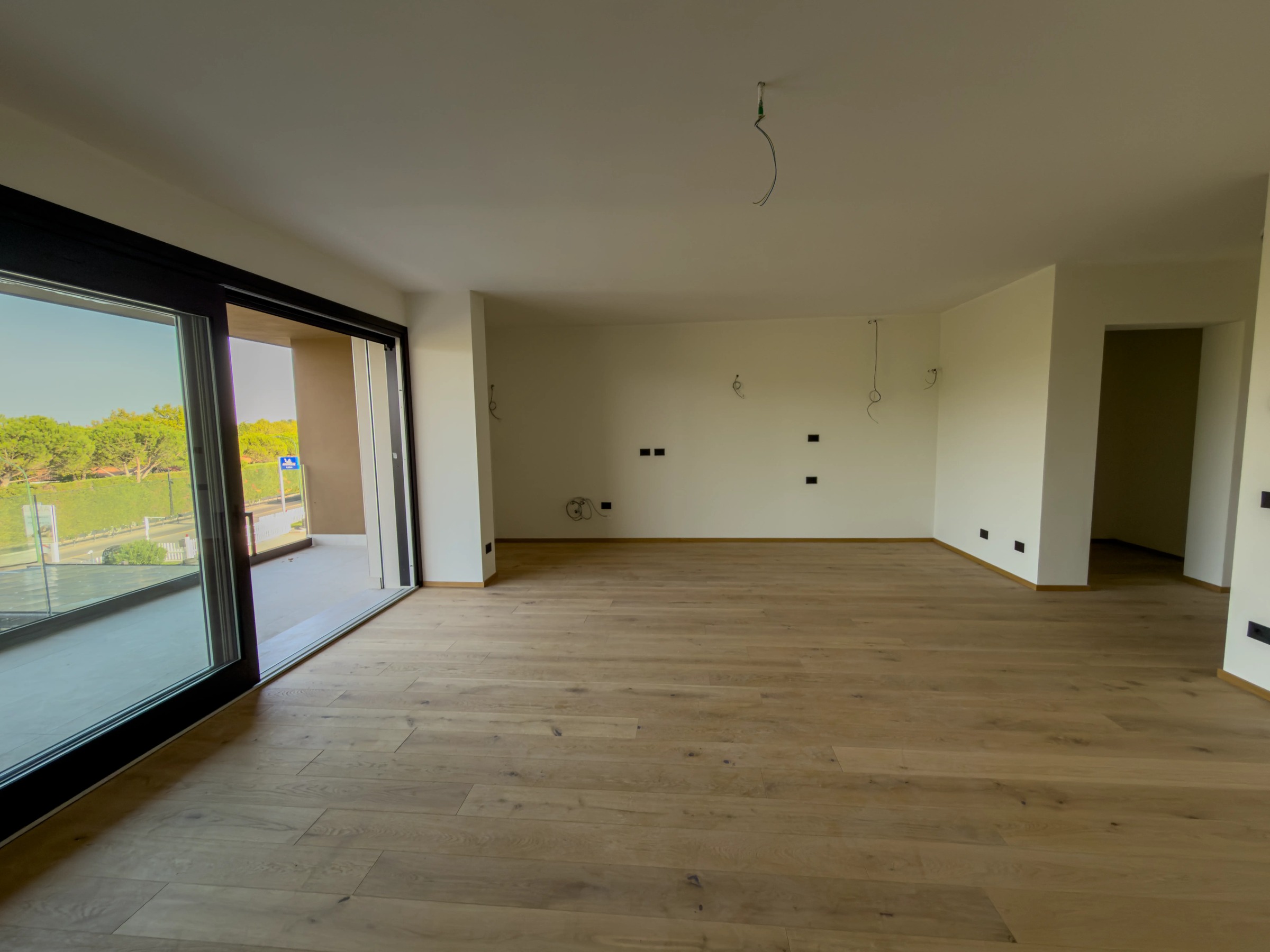 Bright living room with glazing onto the balcony